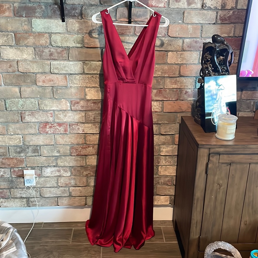 Floor length silky red dress, with slit